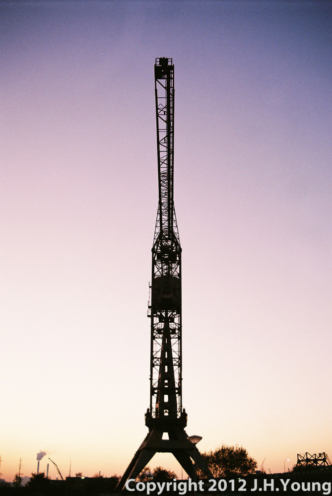 Sunset behind a cranes in Amsterdam