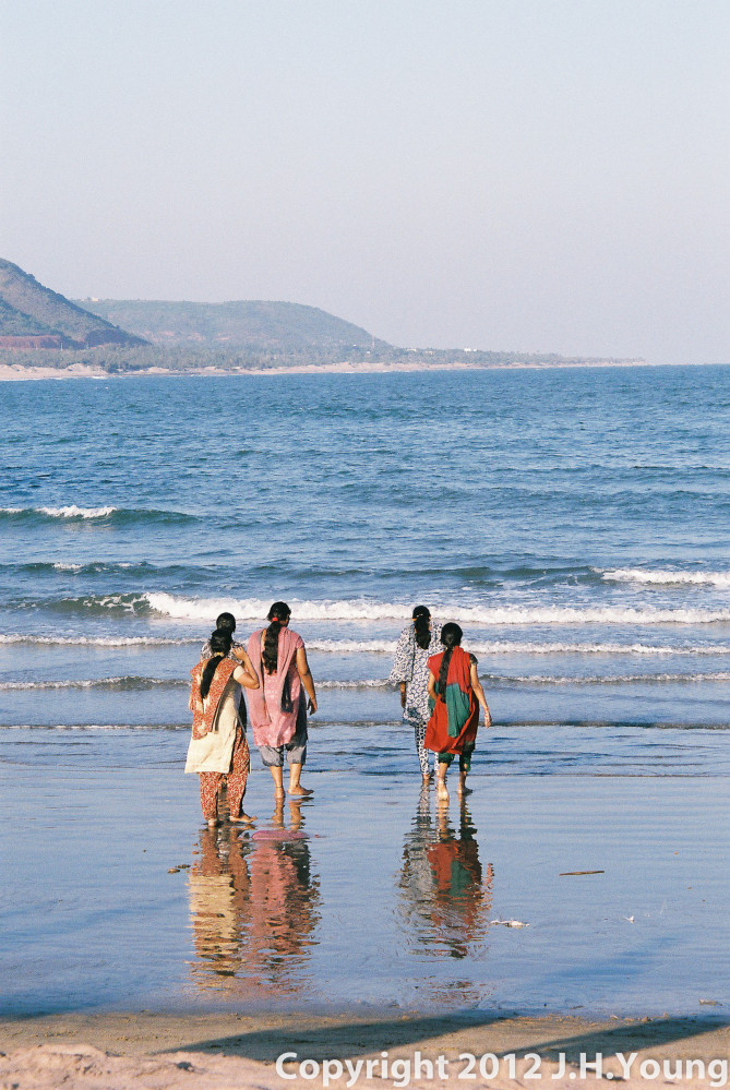 Women paddling in sea, Eastern India